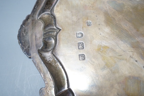 A late George II silver salver, with later engraved decoration, Ebenezer Coker, London, 1758, diameter 32cm, 25.5oz.